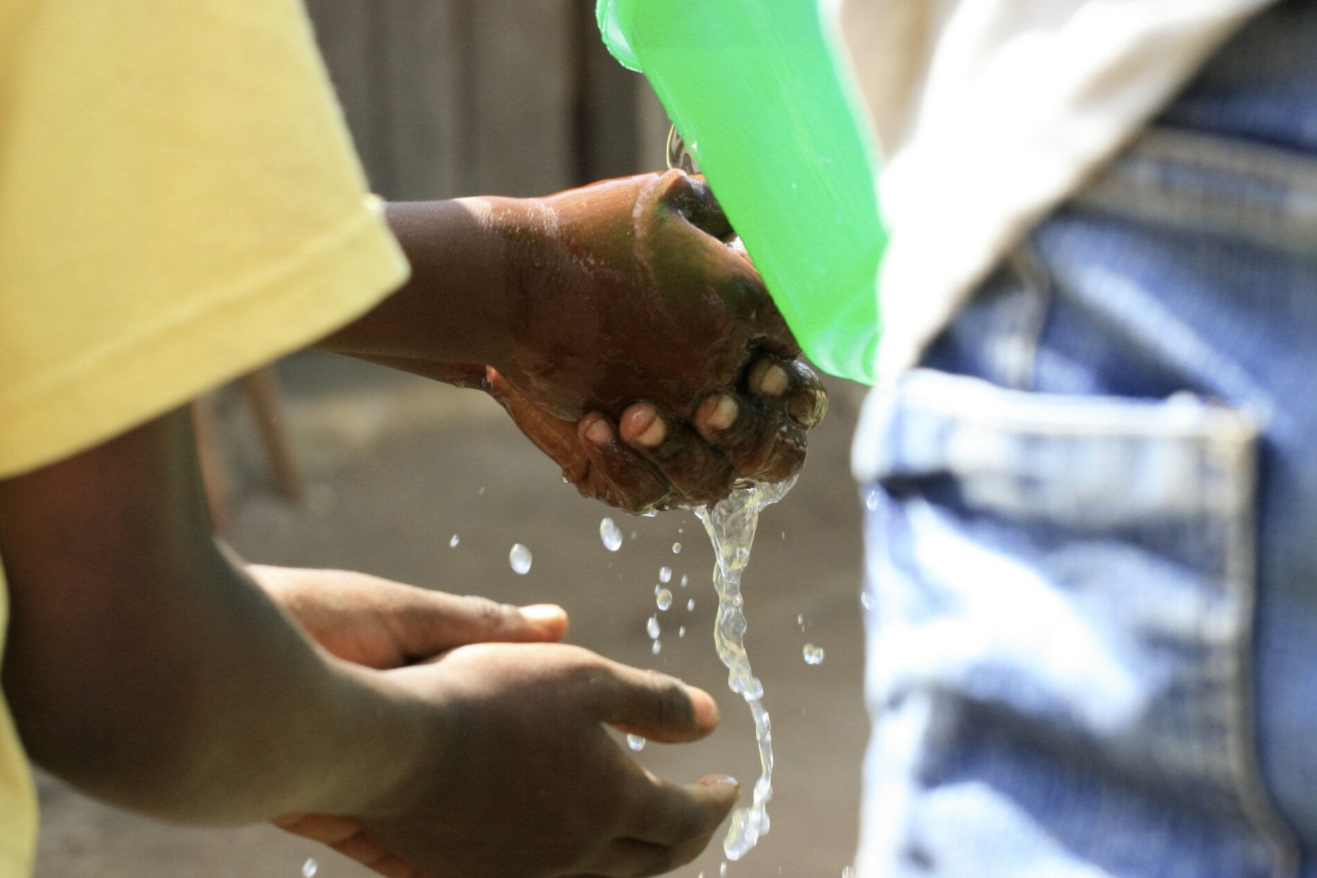 Children wash their hands before eating in Tanzania.