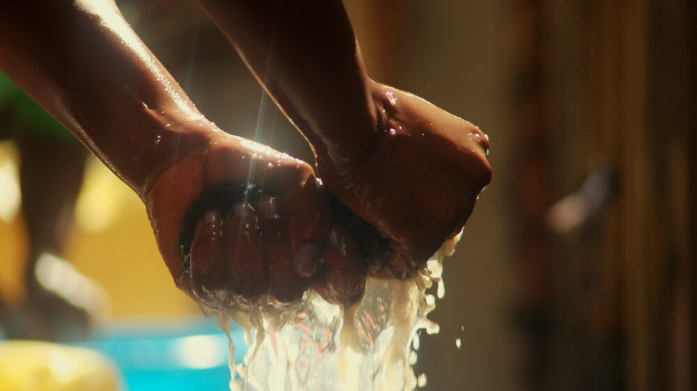 Cropped Hand Squeezing Cloth