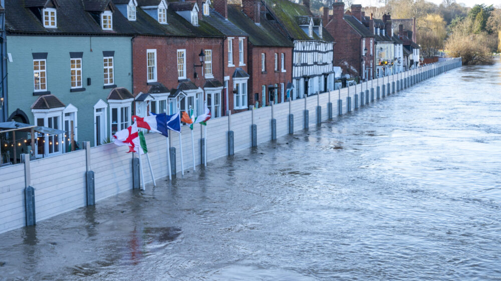Due to climate change, emergency flood defenses are put in place to protect homes.
