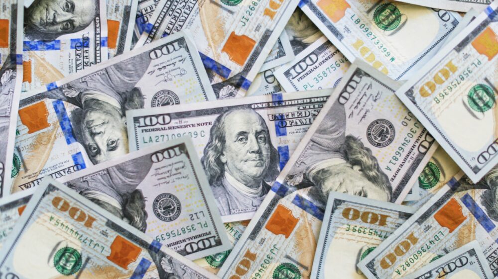 Display of scattered US $100 bills