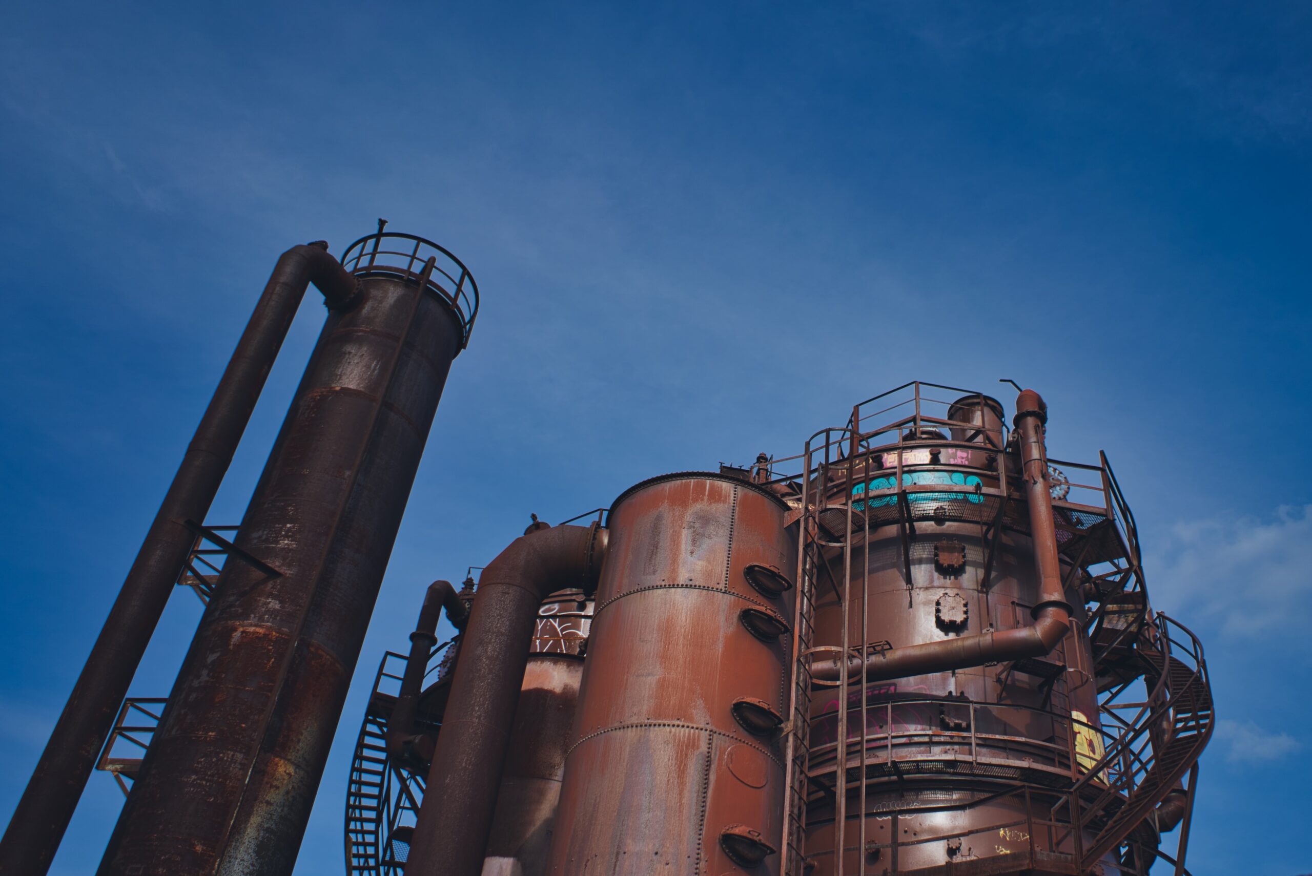 Brown metal construction against a dark blue sky
