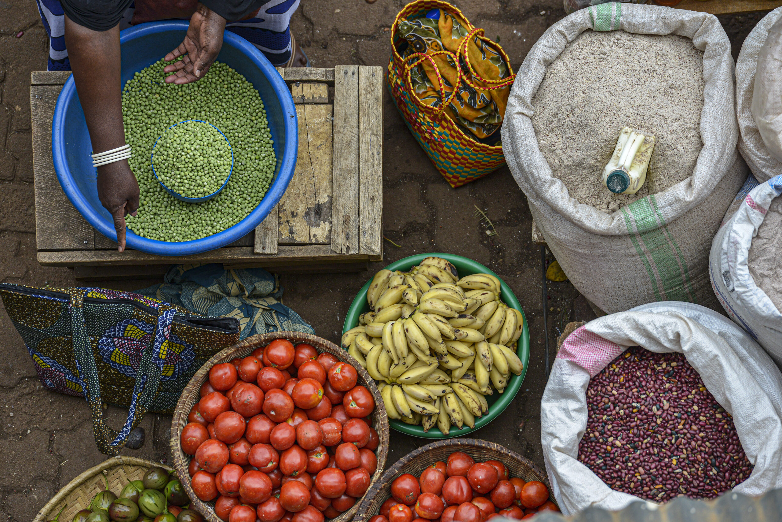 A woman selling fruit in the market Huye in Rwanda.
