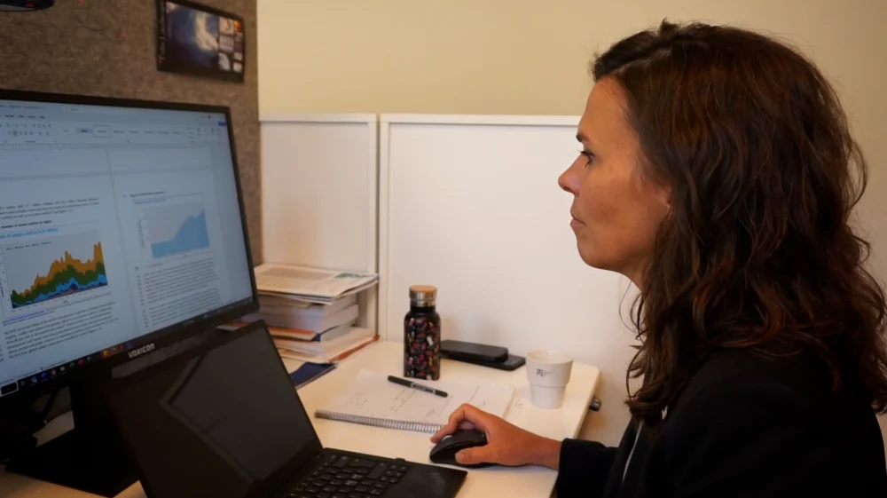 SEI Research Director and Deputy Director Åsa Persson sitting at a desk.