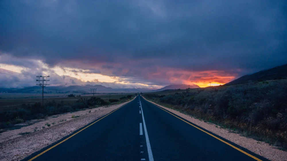 Driving across Africa: unlimited freedom and stunning sunsets. Oudtshoorn, South Africa