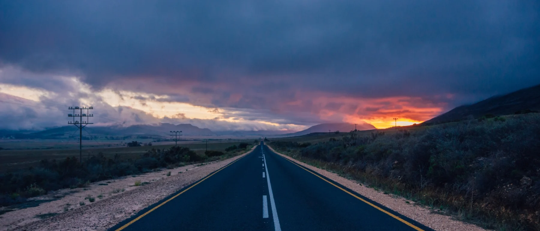 Driving across Africa: unlimited freedom and stunning sunsets. Oudtshoorn, South Africa