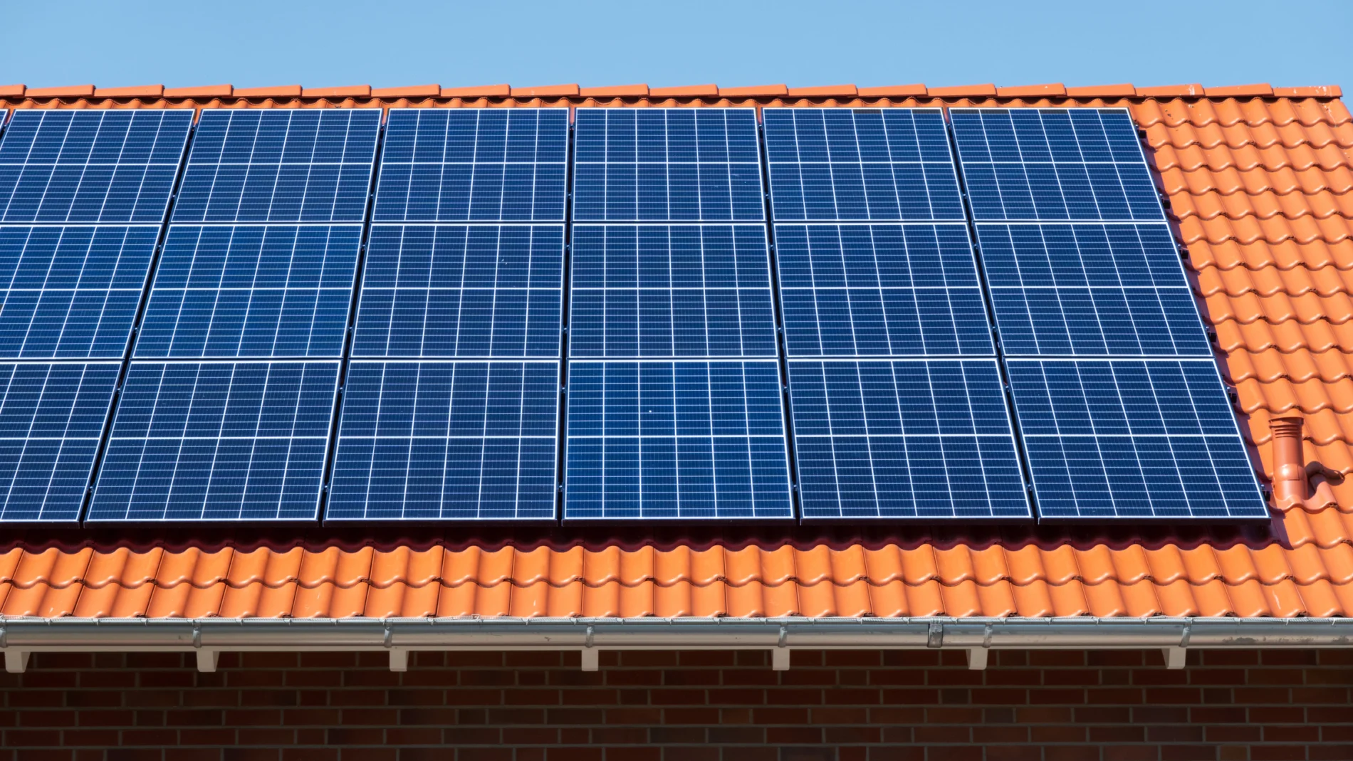 Side view of a large solar panel on the roof