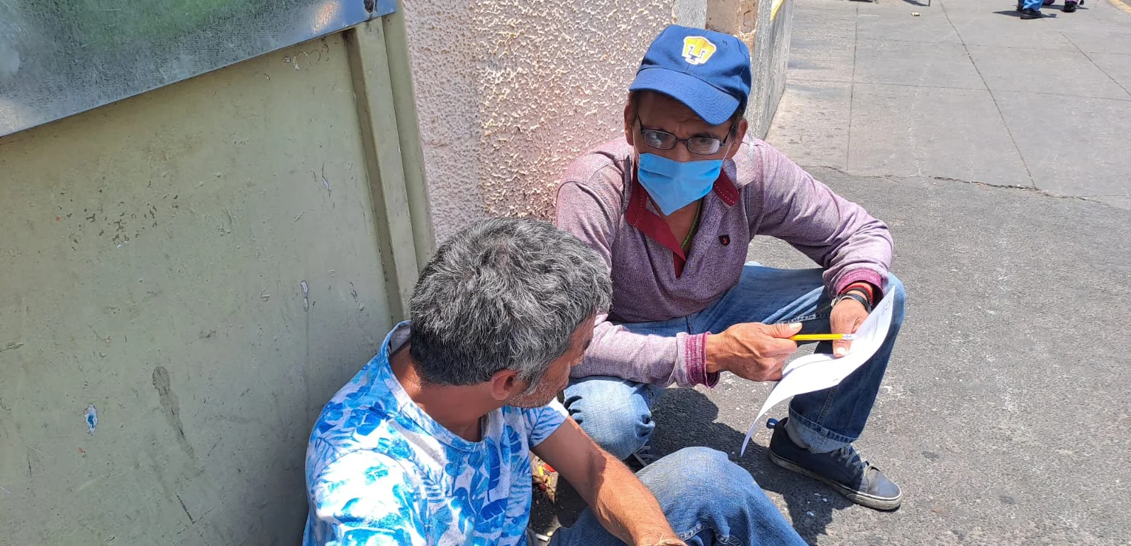 Citizen scientist undertaking data collection with community member