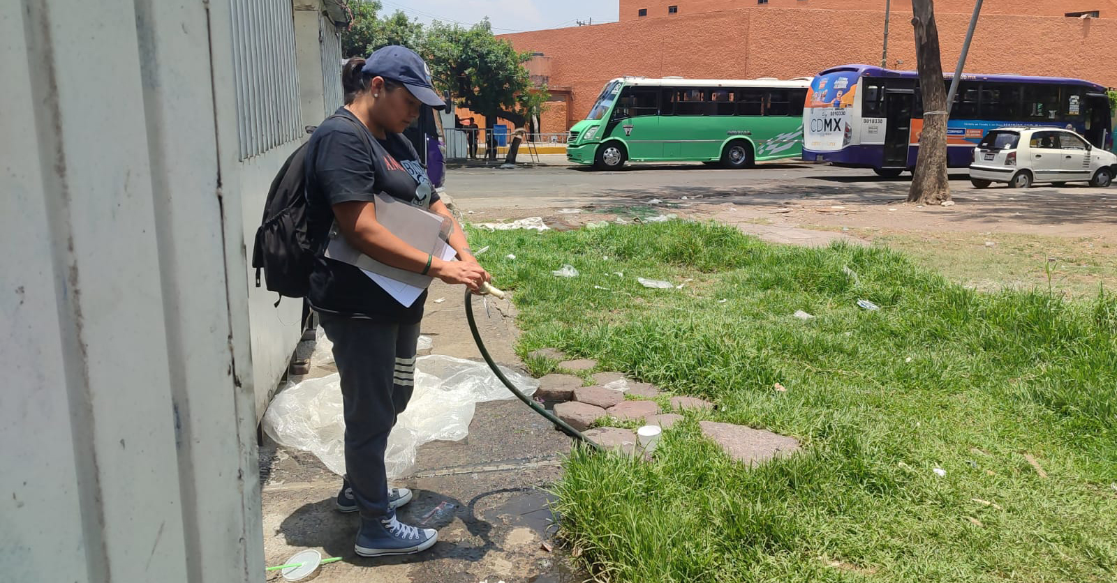 A citizen scientist verifying a water source identified by community members.
