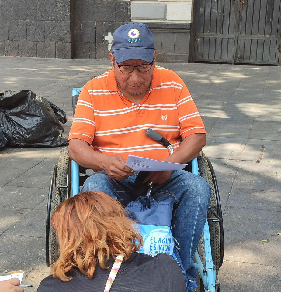 Citizen scientist undertaking data collection with community members