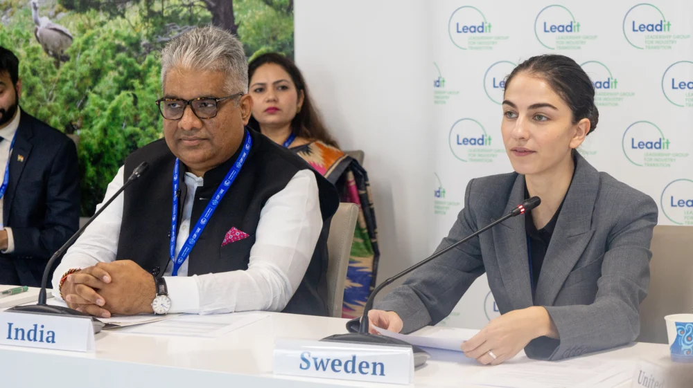 Bhupender Yadav, Minister of Environment, Forest and Climate Change, and Labour and Employment, India, and Romina Pourmokhtari, Minister for Climate and the Environment, Sweden sitting at a table during the LeadIT COP28 event.