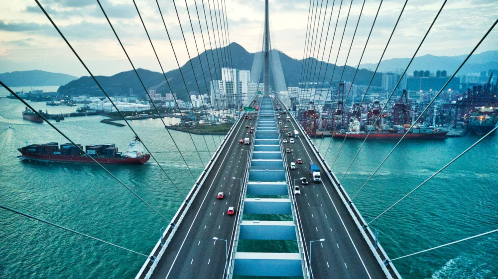 View from above along a suspension bridge across a channel in Hong Kong