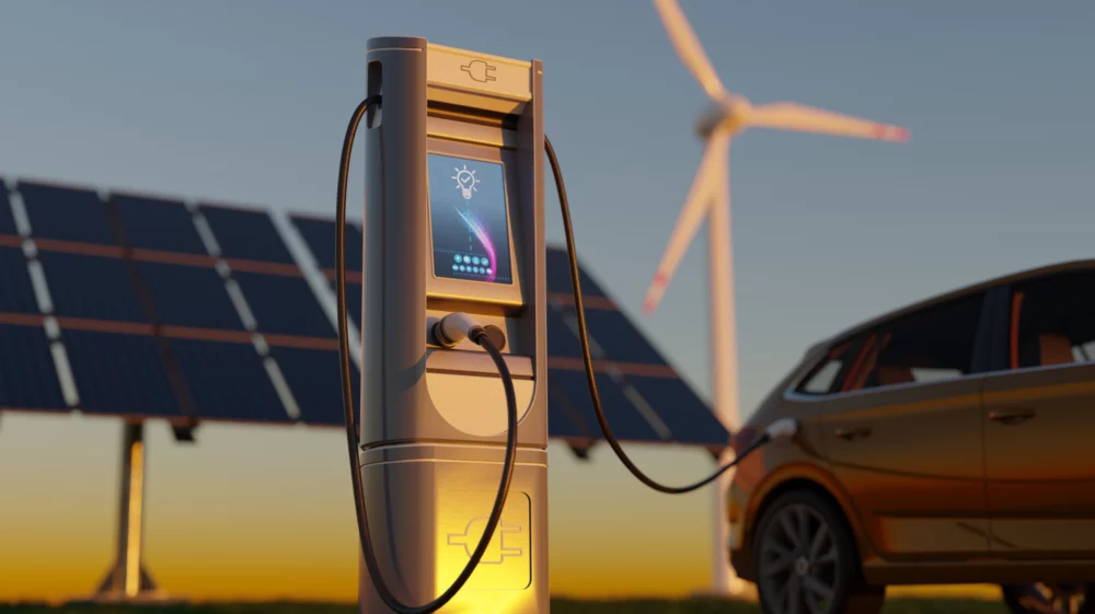 Electric car charging with wind turbines and solar panel.