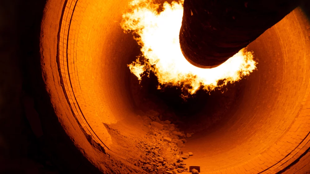 Closeup of a rotary kiln for clinker production in a cement plant