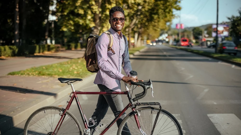 Man pushing bicycle