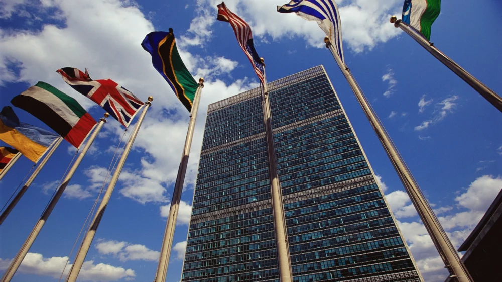 Flags fly outside the General Secretariat Building at the United Nations Headquarters