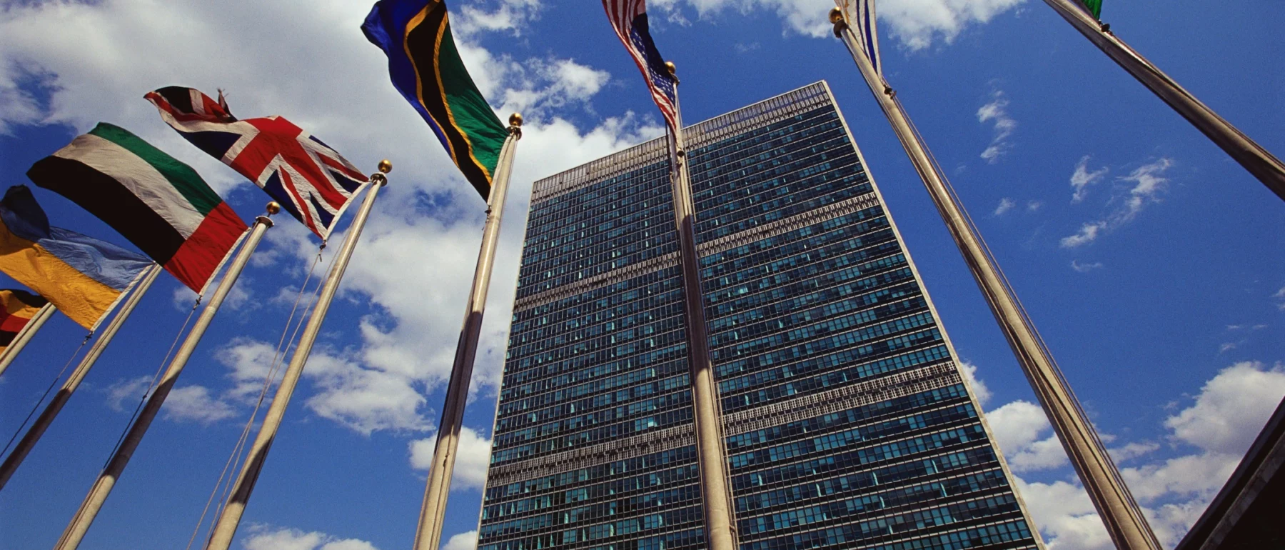 Flags fly outside the General Secretariat Building at the United Nations Headquarters