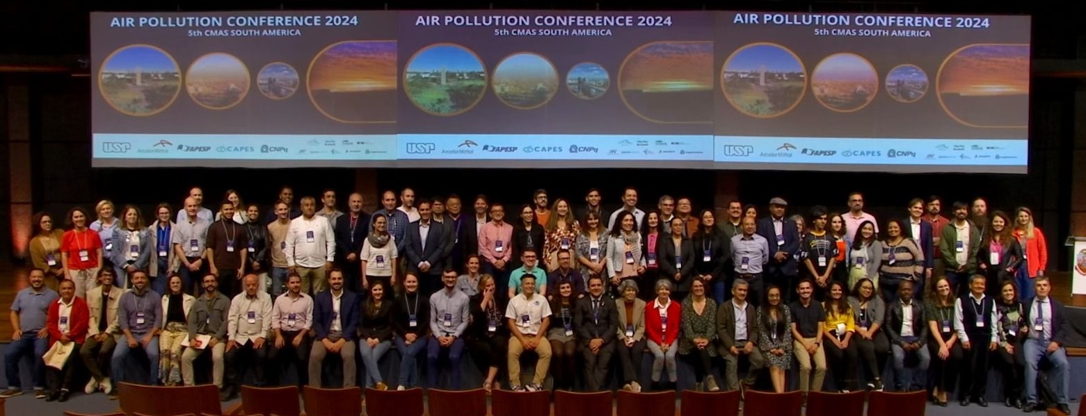 Large group of conference delegates seated in rows in front of screens showing the banner for the Air Pollution Conference Brazil and 5th CMAS South America 5 to 7 June 2024.