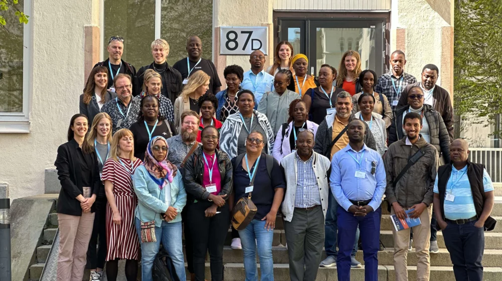 A group photo of participants in the network standing outside Stockholm Environment Institute headquarters. They are from various international and Swedish regions and municipalities.