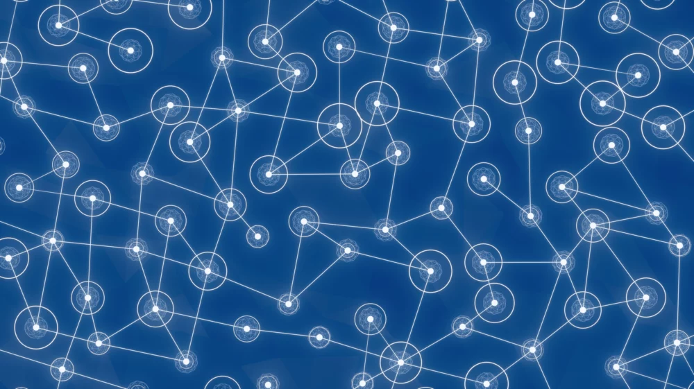 White dots with clouds of white spirals on a blue background, connected by white lines in a random pattern.