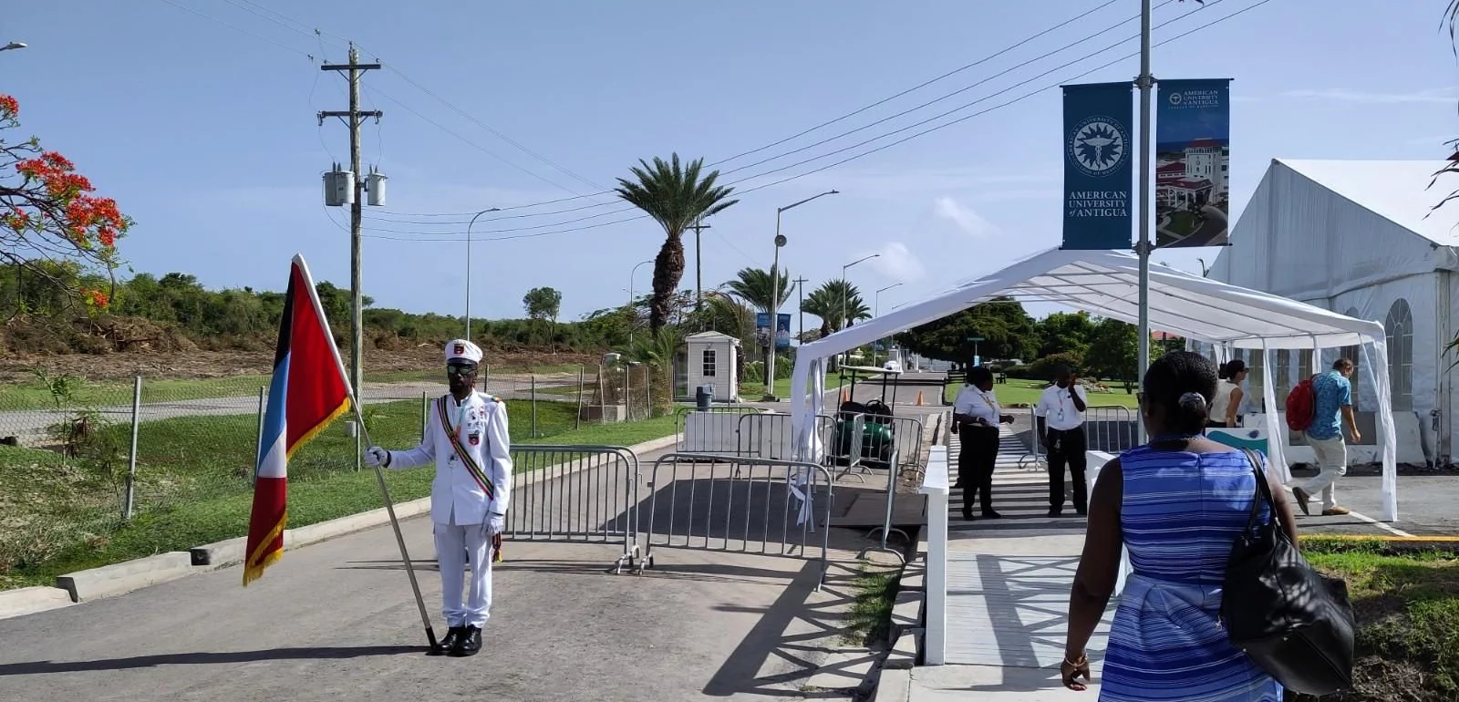A flag guard stands at the entrance to the SIDS4 conference at the University of Antigua.