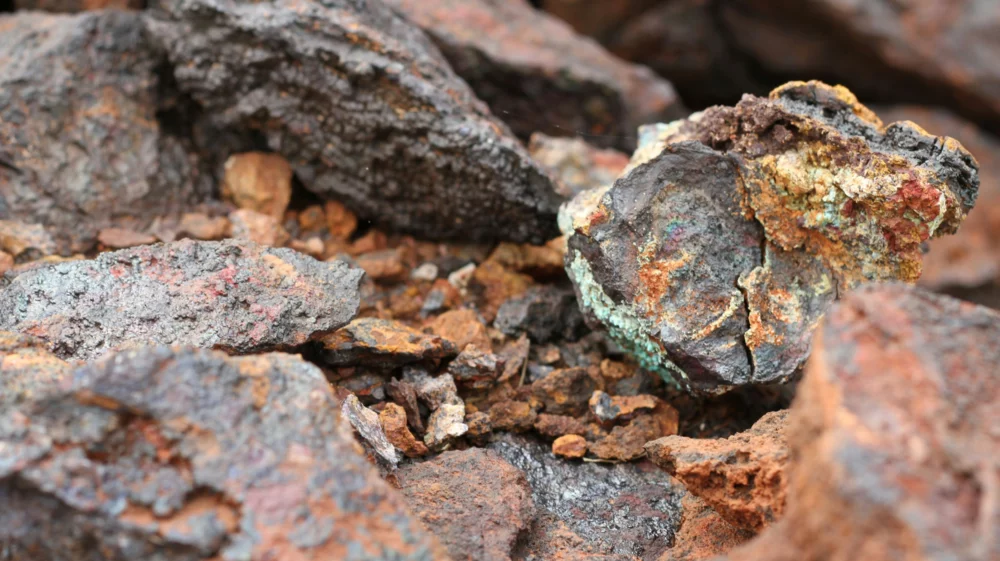 A close up of a rock with lichen on it. Ore containing copper, cobalt and nickel at the Andover mine in Western Australia.