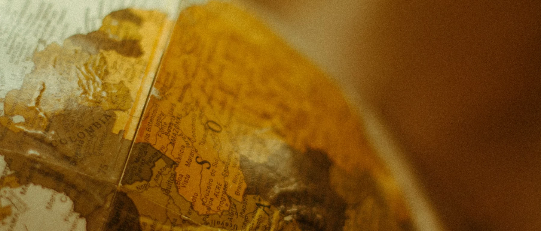Close-up view of a globe showing Colombia and surrounding countries in northern South America.