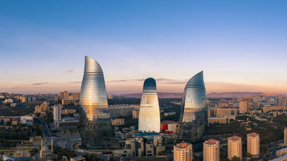 A cityscape of Baku, with three high rise buildings standing out.
