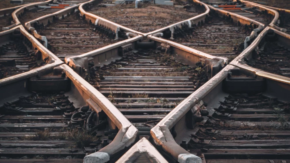 Crossing tracks in diamond patterns diverging in the distance.