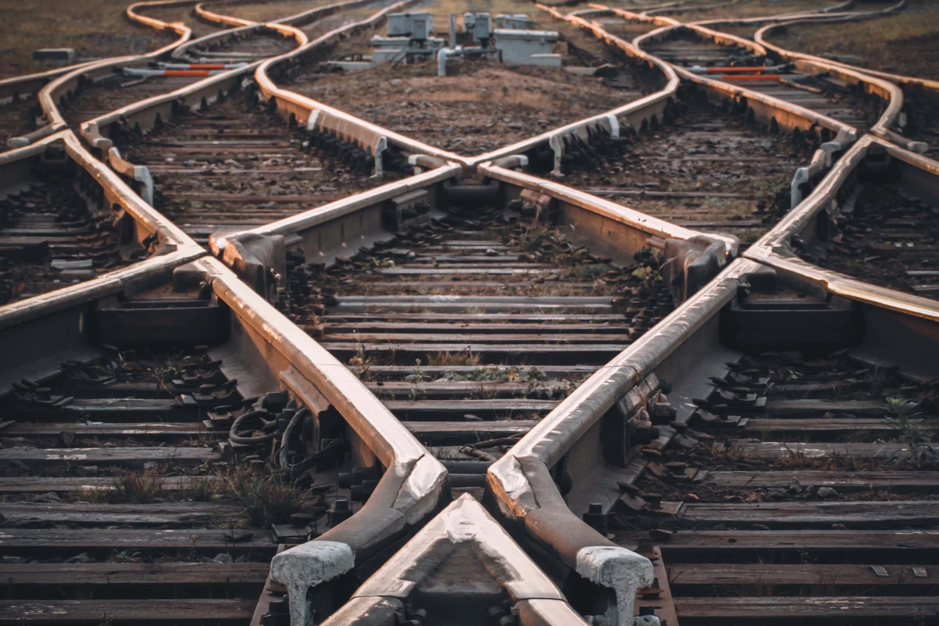 Crossing tracks in diamond patterns diverging in the distance.