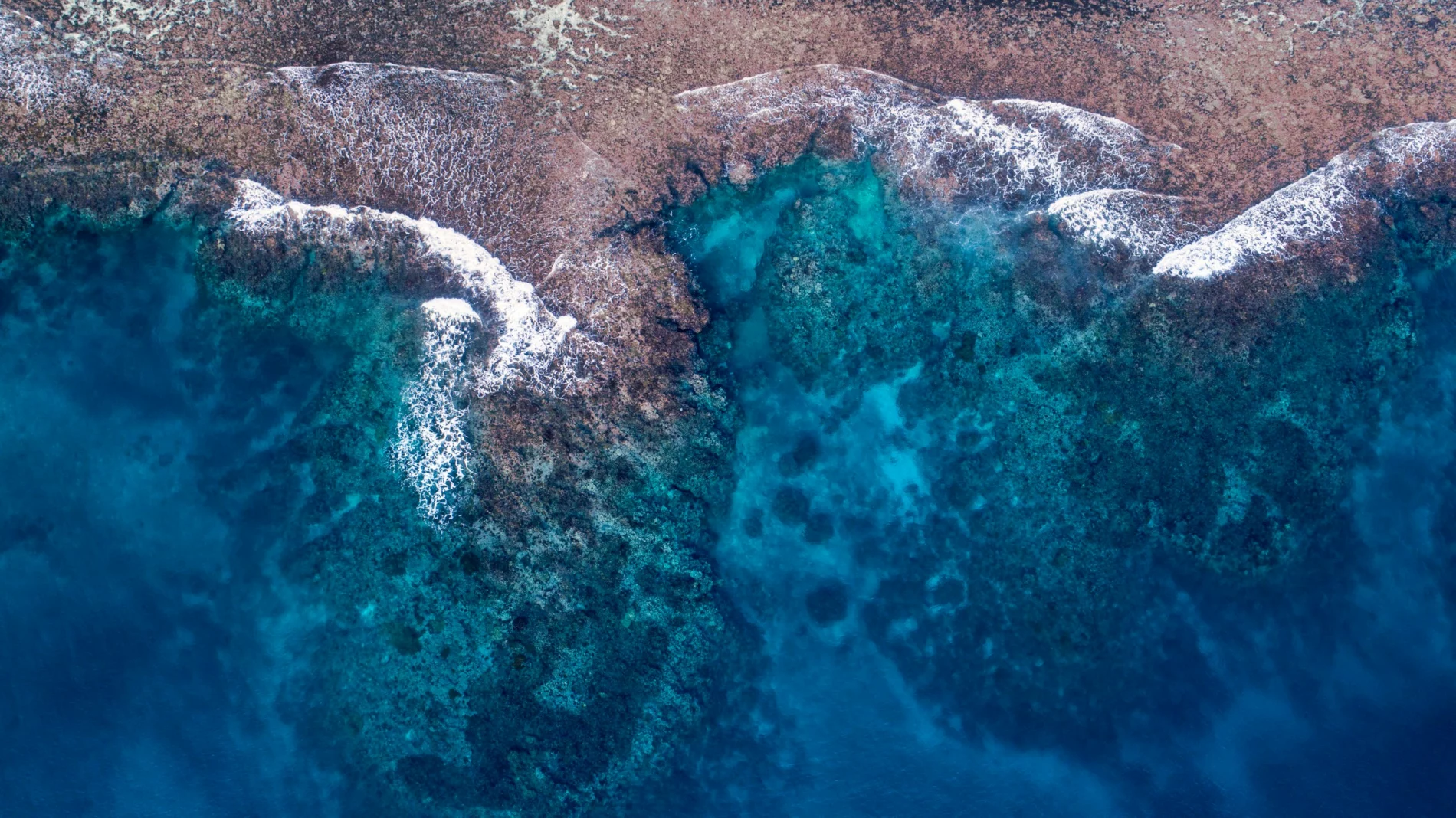 Blue waters touch sandy beach, Lelepa, Vanuatu