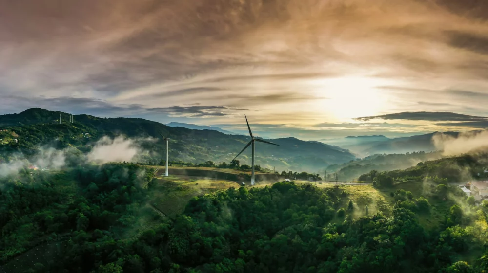 Colorful sunrise and wind turbines in Cartago, Costa Rica.