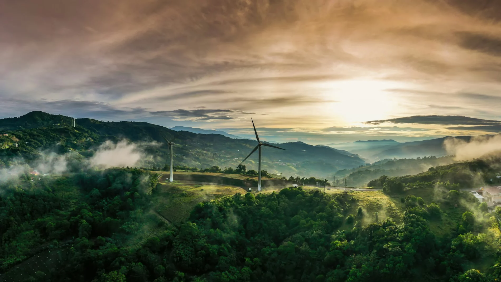 Colorful sunrise and wind turbines in Cartago, Costa Rica.