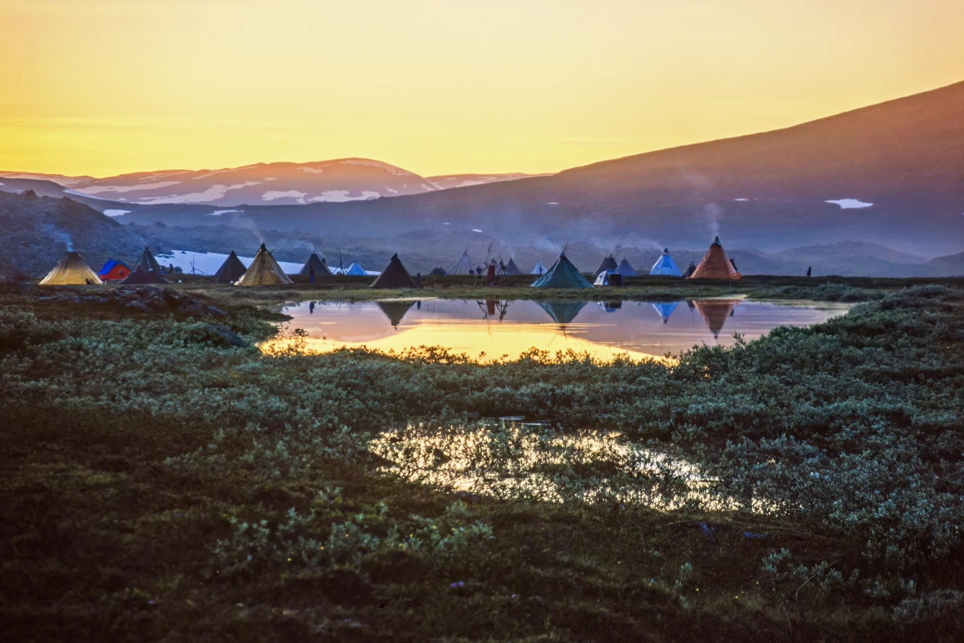 Tent settlement for reindeer herders in the midnight sun at the north of Sweden
