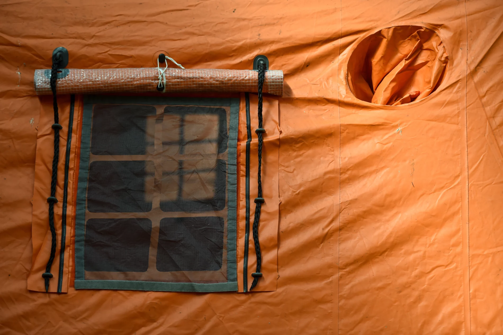 A window from a refugee orange tent