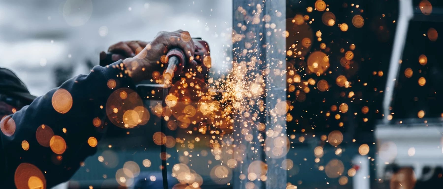 Showing hands soldering creating sparks