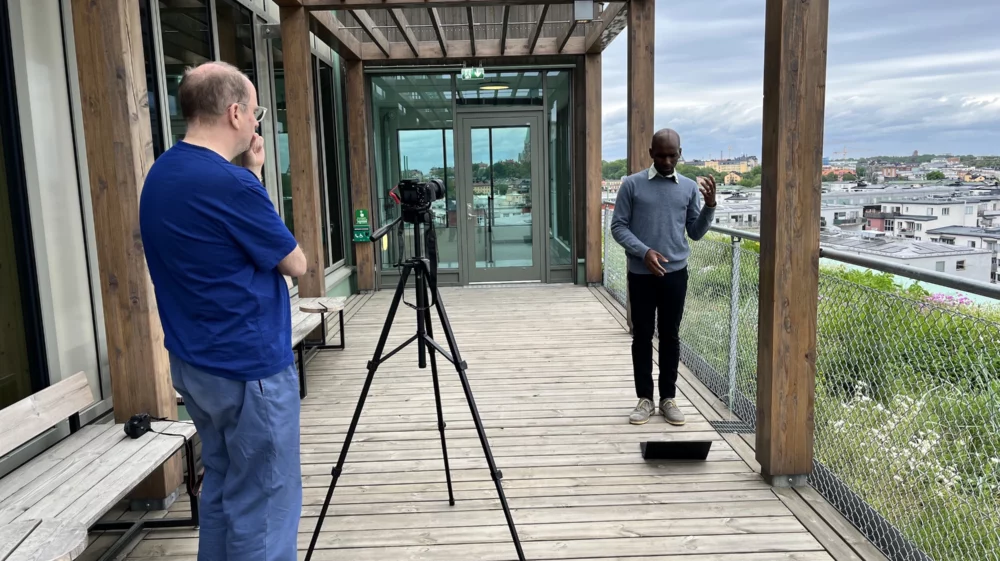 Behind the scenes filming an interview with an SEI colleague