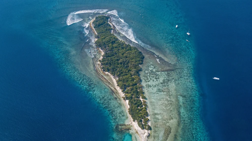 Tropical island on sea, aerial view